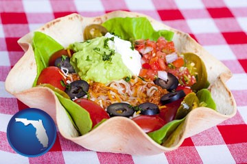 a texmex taco salad in a baked tortilla - with Florida icon